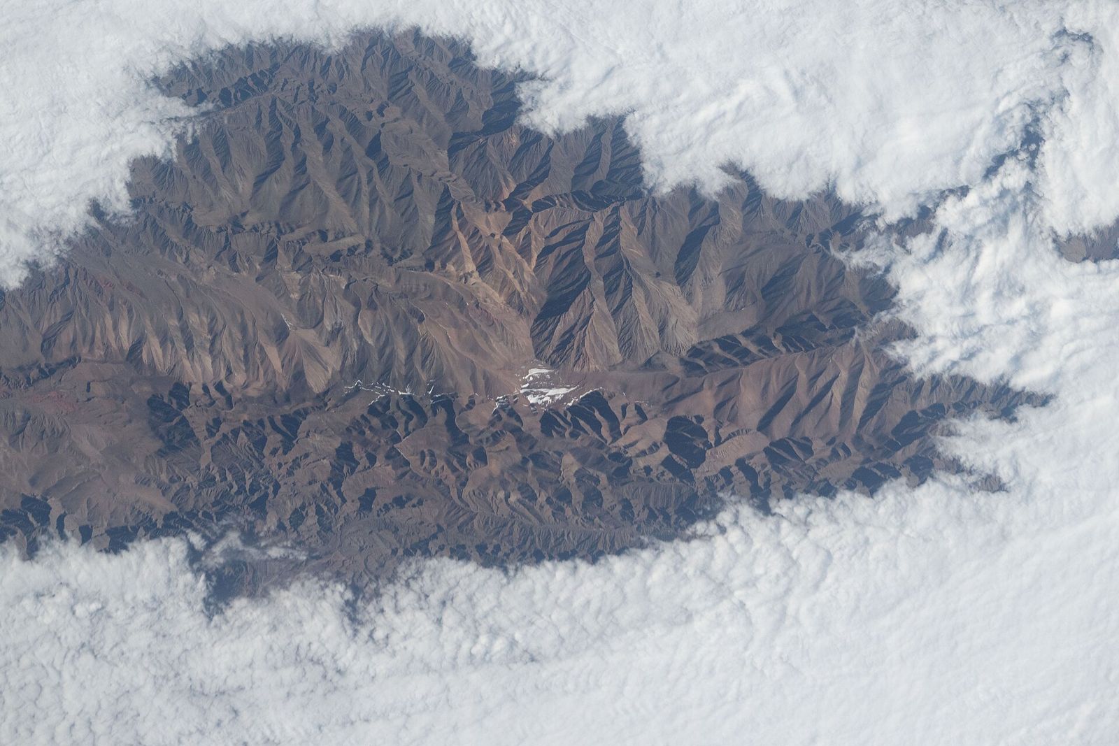 Cloud pooled between Andean peaks