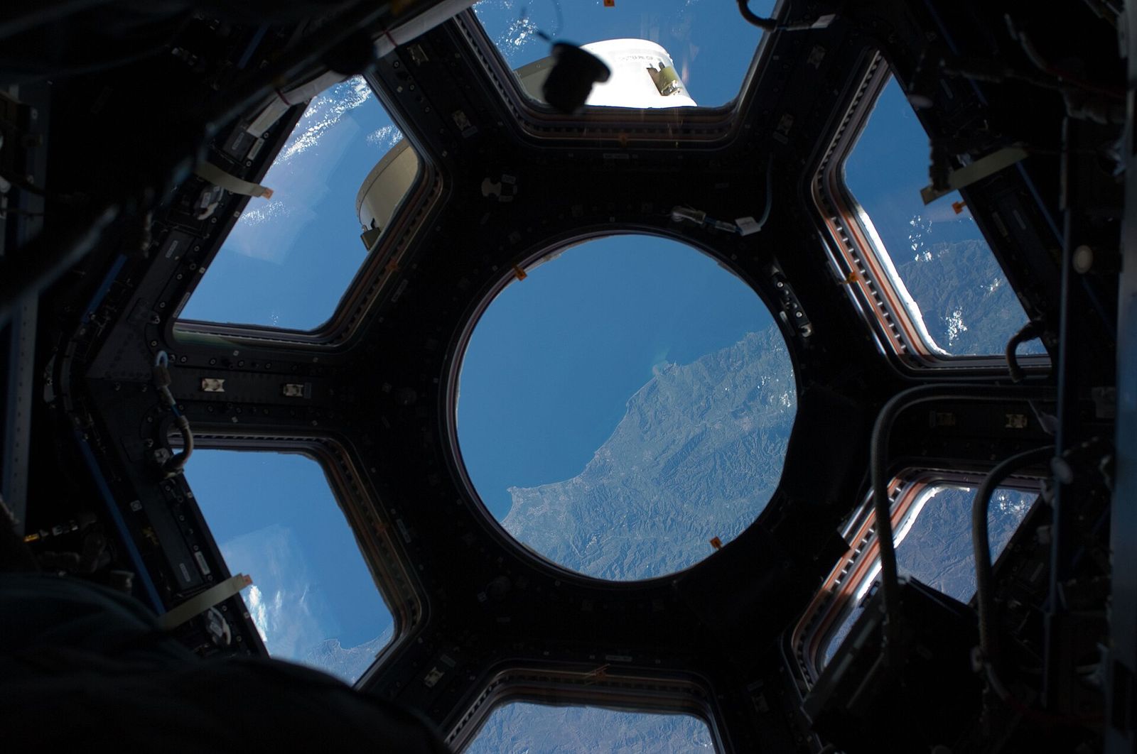 The coast of Algeria seen through a window of the station’s cupola.