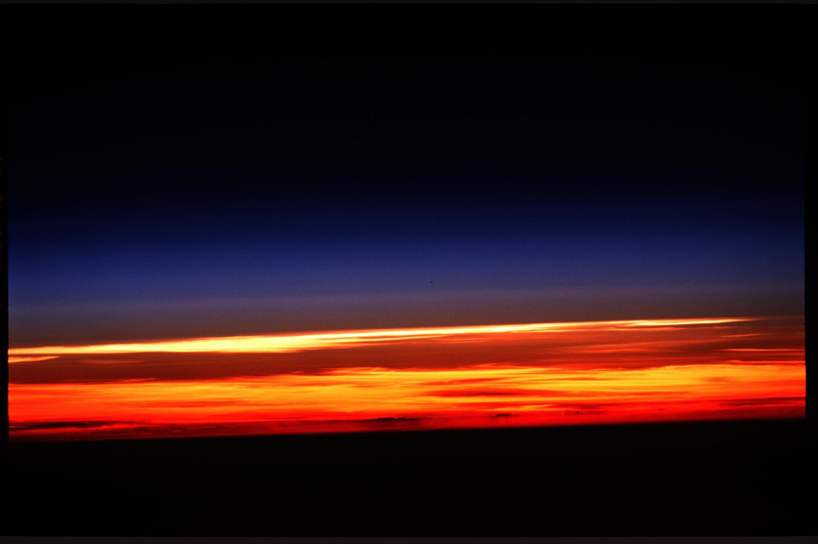 The thin blue line of Earth’s atmosphere at the limb, seen from orbit at sunset