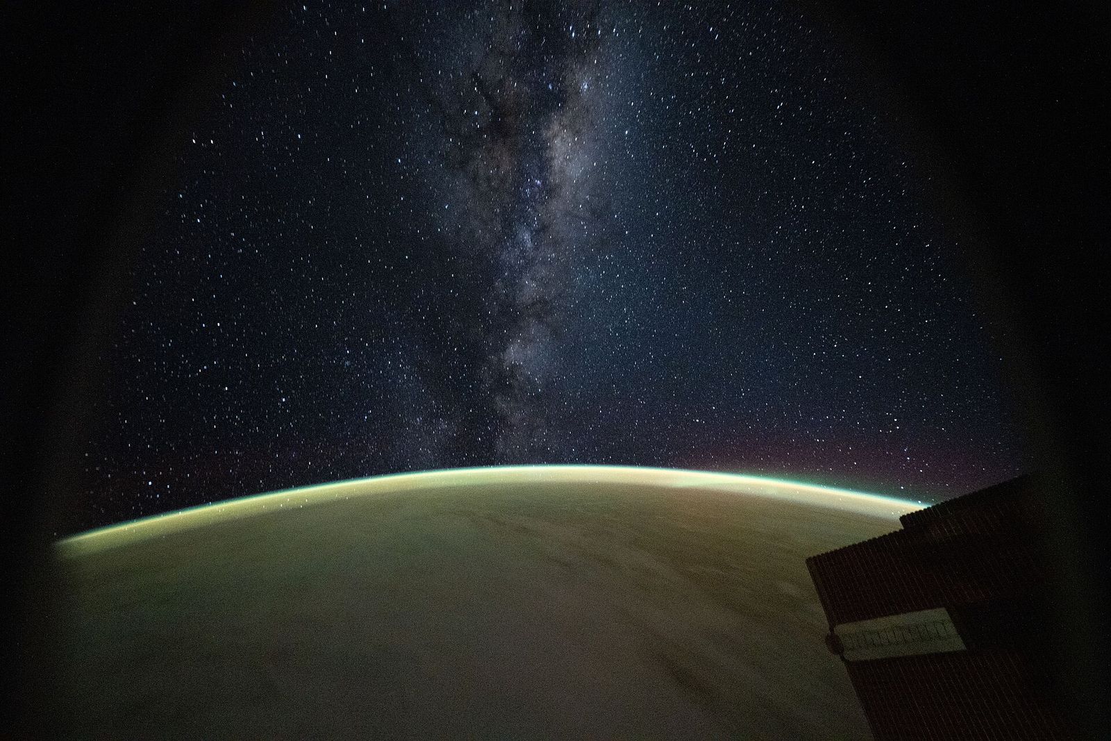 The Milky Way rising above the glow of Earth’s atmosphere